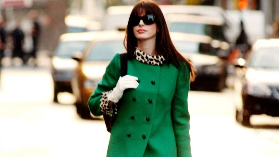 Image may contain Anne Hathaway Clothing Coat Person Adult and Overcoat