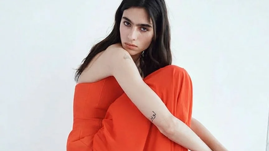 Image may contain Clothing Dress Adult Person Fashion Formal Wear Gown and Evening Dress