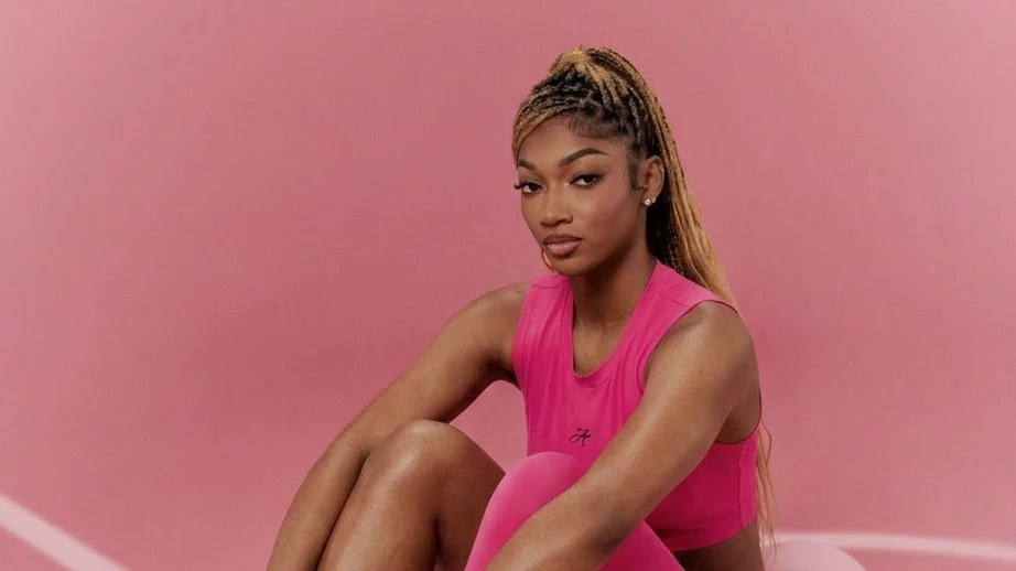 Angel Reese posing in her signature shoe.