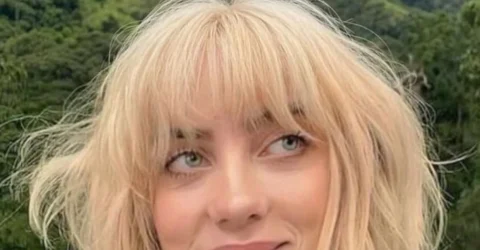 Billie Eilish poarta un top de 28 de dolari fara sutien. Fanii o acuza de editare AI