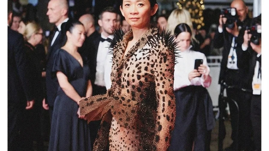 Image may contain Chlo Zhao Aya Sumika Barbara Walsh Fashion Adult Person Wedding Premiere Red Carpet and Face