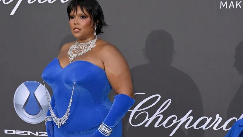 Image may contain Lizzo Clothing Dress Evening Dress Formal Wear Fashion Gown Adult Person Face and Head
