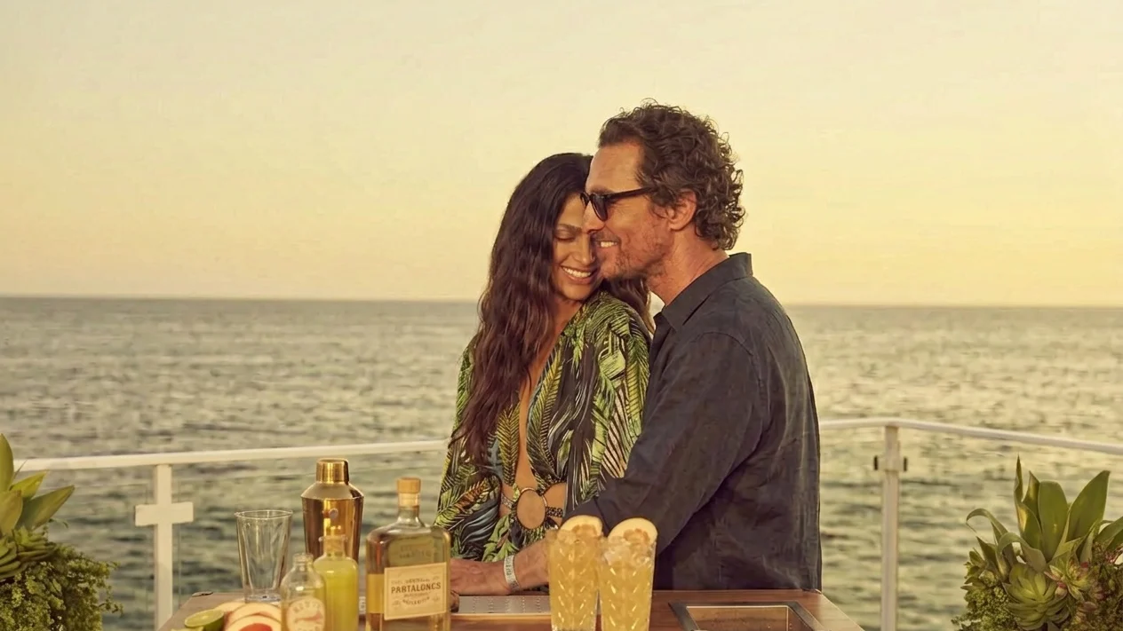Matthew McConaughey and Camila McConaughey with drinks