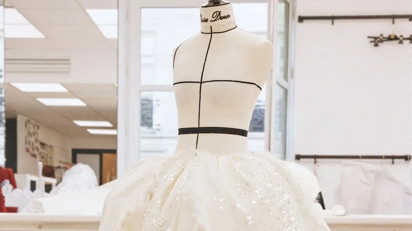 Image may contain Clothing Dress Fashion Formal Wear Gown Wedding Wedding Gown Adult and Person
