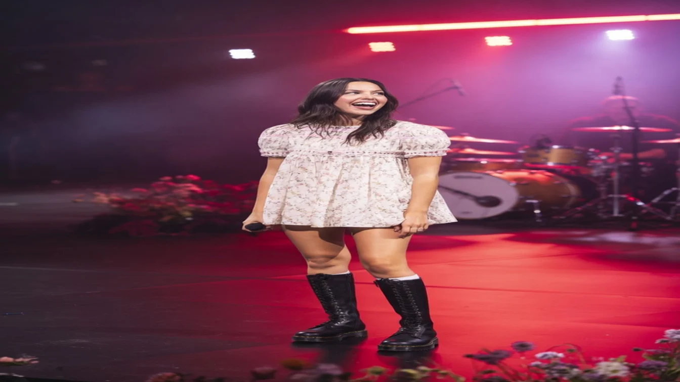 Olivia Rodrigo performs on stage wearing a much-debated babydoll dress