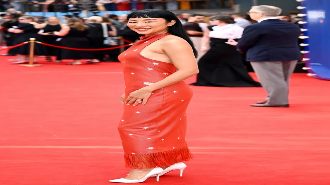 Image may contain Greta Lee Fashion Adult Person Clothing Dress and Premiere