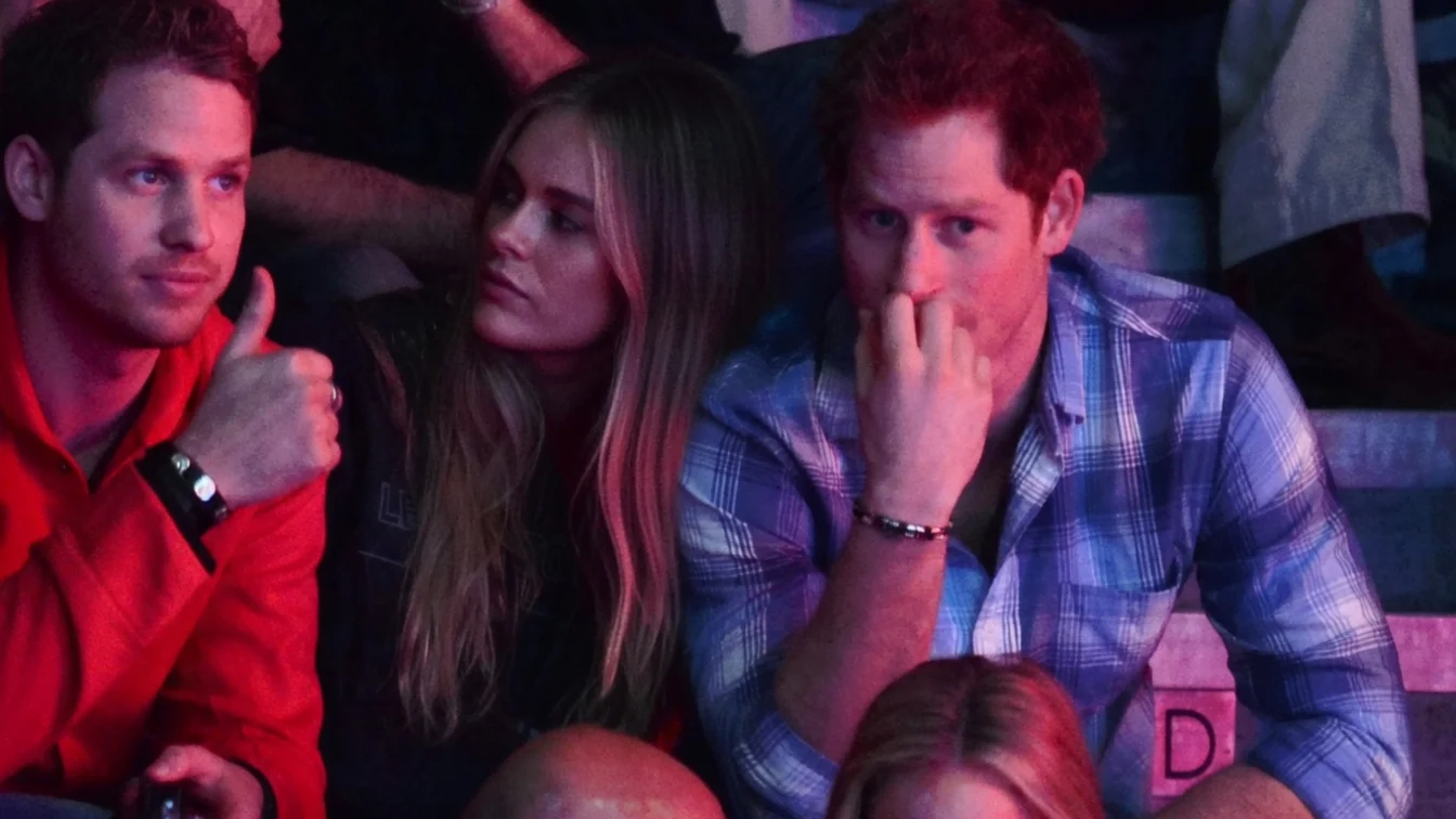 Cressida Bonas and Prince Harry sitting at an event