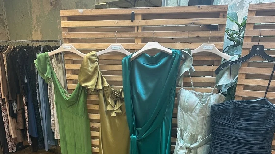 Image may contain Bridesmaid Dress Mannequin Clothing Dress and Sleeve