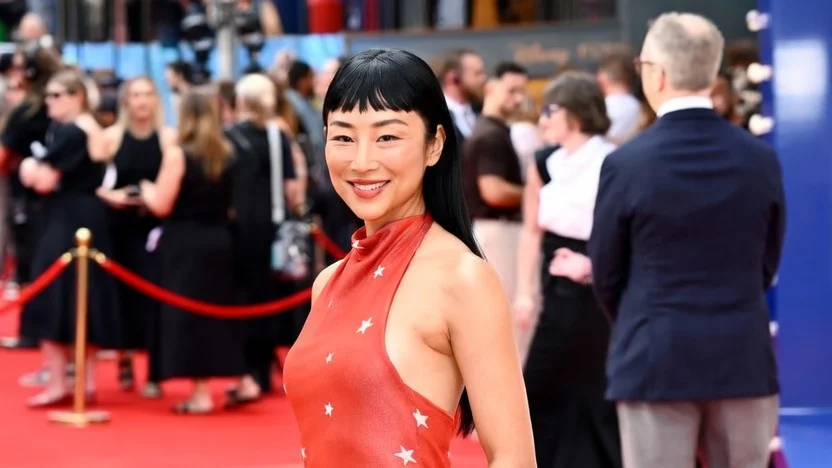 Image may contain Greta Lee Fashion Adult Person Clothing Dress and Premiere