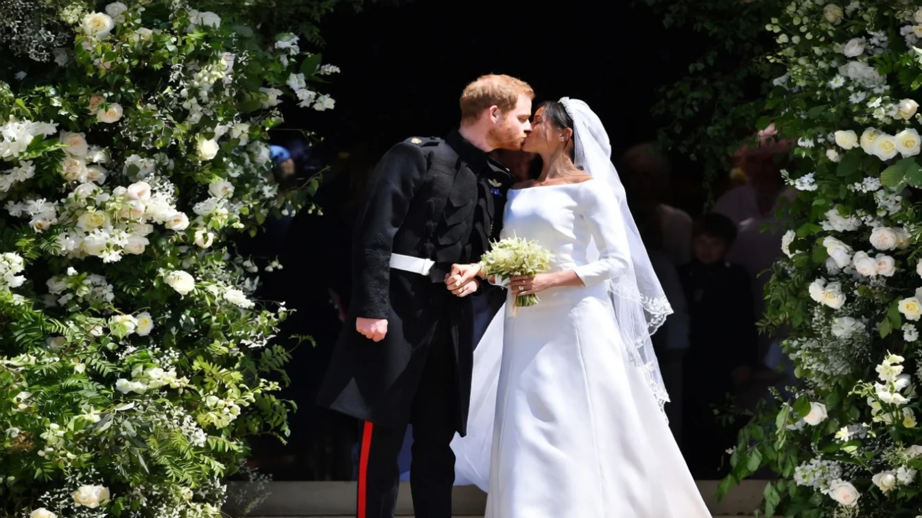 Newlyweds Prince Harry and Meghan Markle kiss following their wedding ceremony