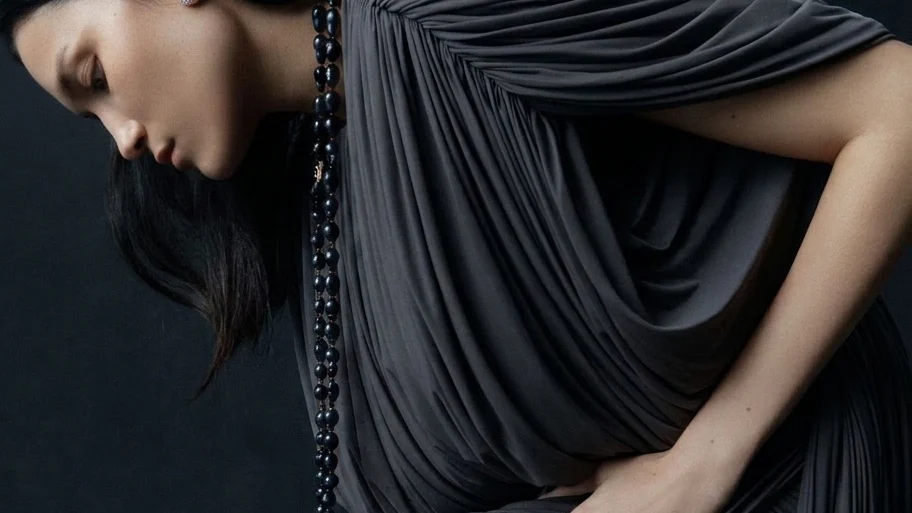 Image may contain Clothing Dress Adult Person Formal Wear Sleeve Accessories Jewelry Necklace and Evening Dress