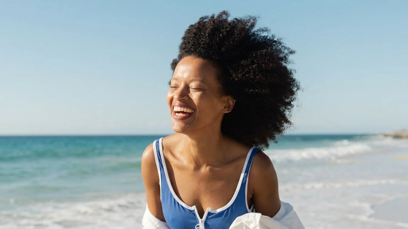 Portrait of a beautiful, smiling African American woman on the beach