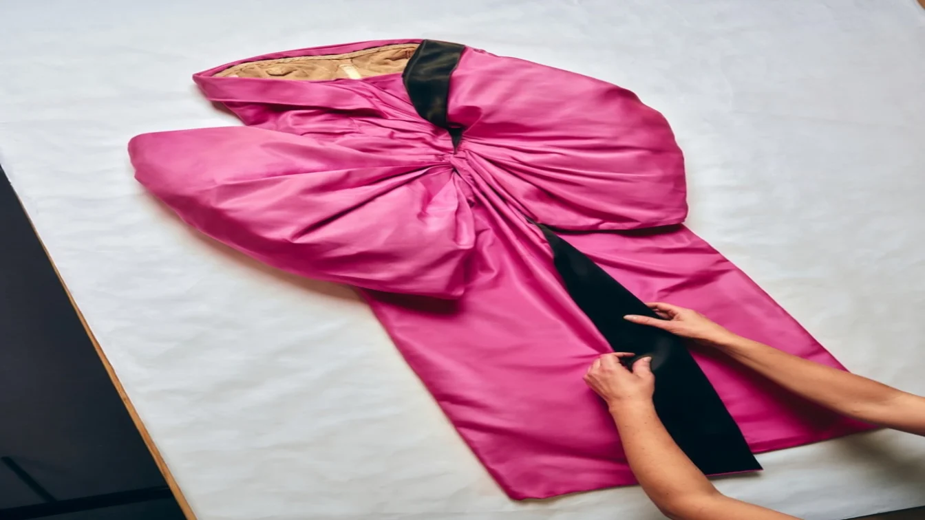 Image may contain Fashion Clothing Coat Robe Adult Person and Cape