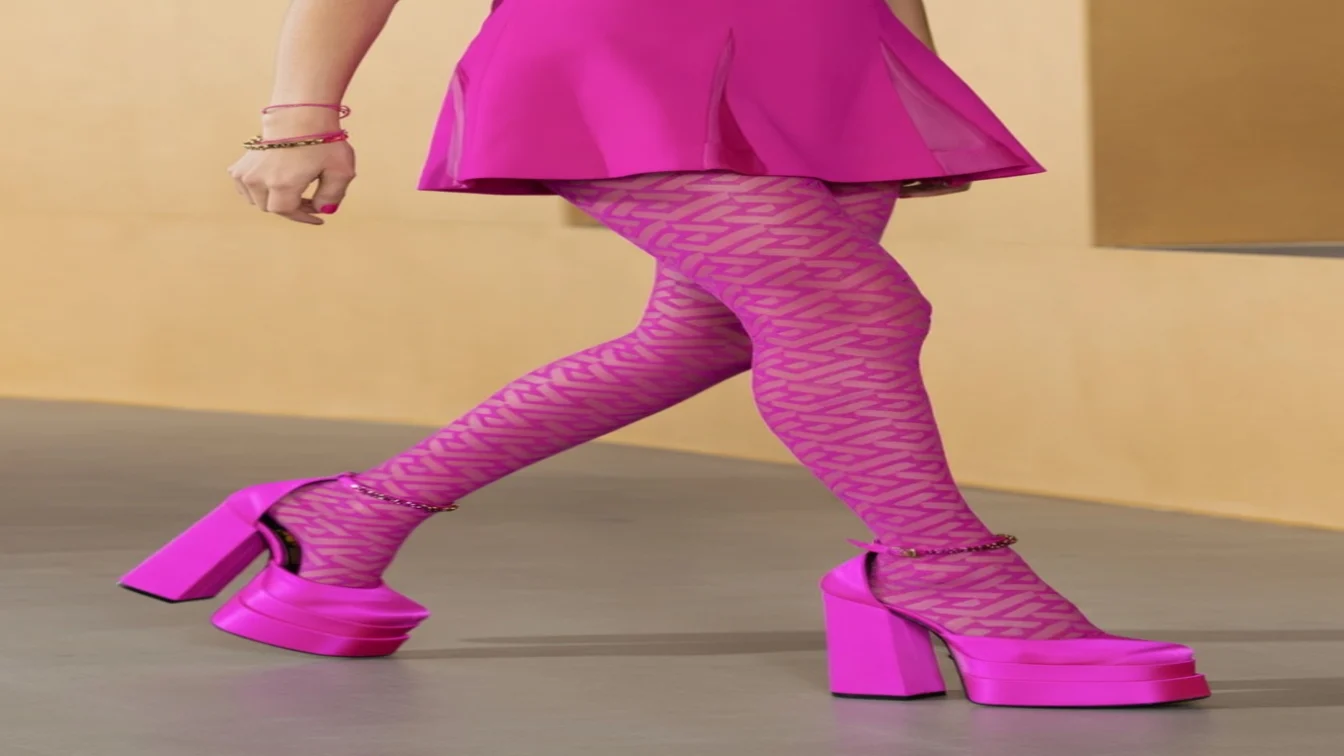 Image may contain Clothing Apparel Pants Shoe Footwear Human Person and High Heel