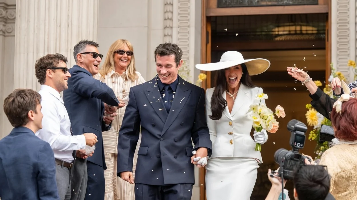 Image may contain Callum Turner Dua Lipa Person Blazer Clothing Coat Jacket Adult Formal Wear Suit and Wedding