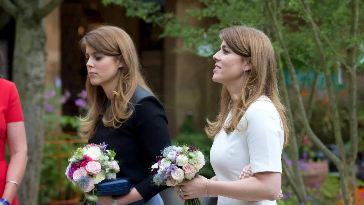 Princess Eugenie and Princess Beatrice in the RHS Greening Grey Britain Garden by Anne-Marie Powell attend the Chelsea Flower Show press day