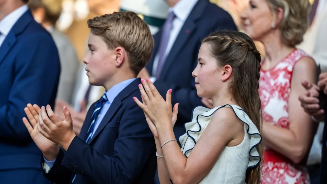 Prince George of Wales, and Princess Charlotte of Wales, applaud in the Royal Box at the Gentlemen's Singles Final on Centre Court during the Wimbledon Lawn Tennis Championships at the All England Lawn Tennis and Croquet Club at Wimbledon on July 13th, 2025, in London, England