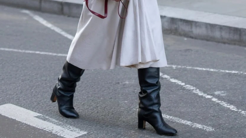 Image may contain Clothing Coat Pants Accessories Bag Handbag Footwear Shoe Overcoat Jeans Blazer and Jacket